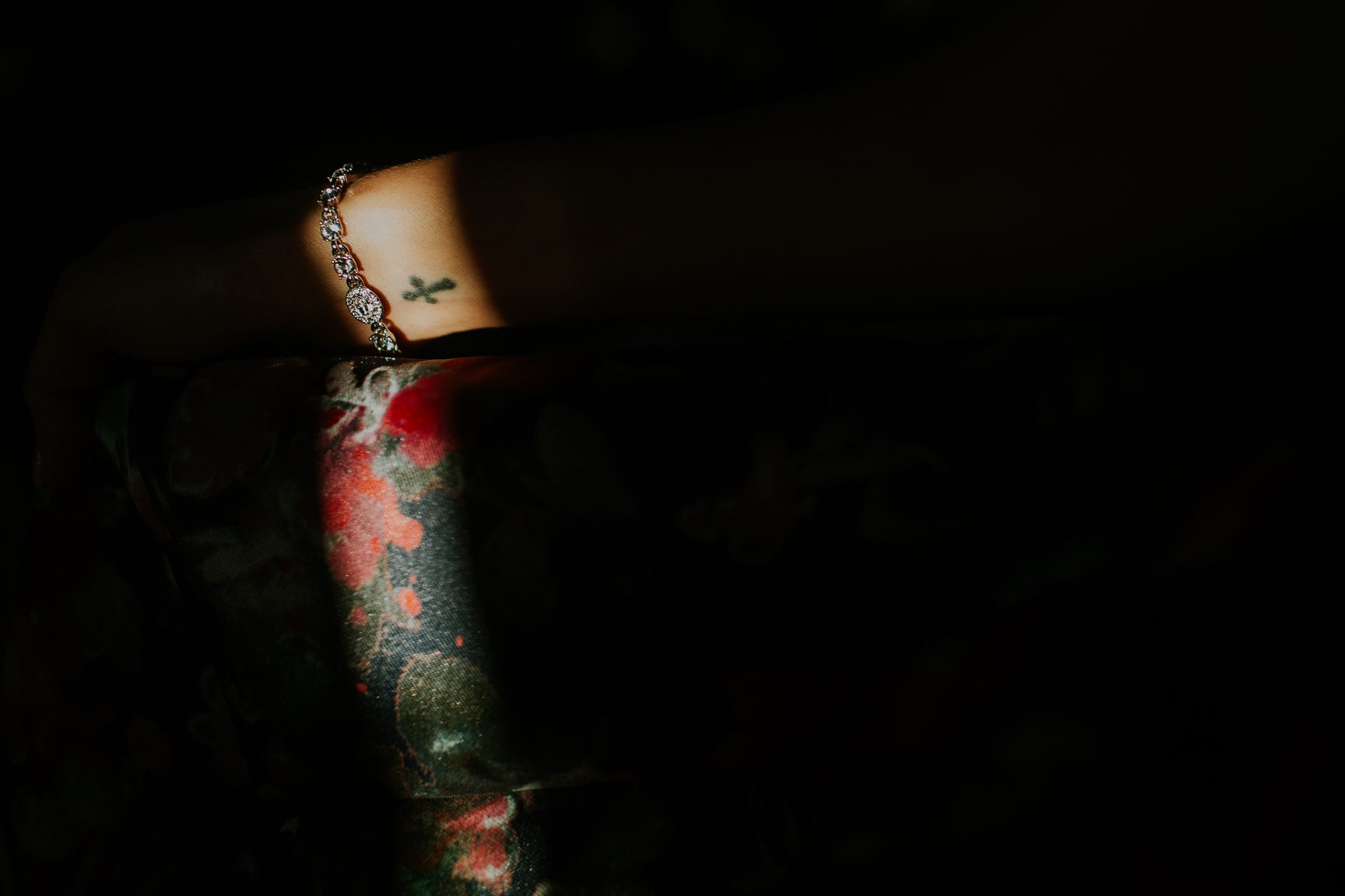 cross tattoo and flowered dress