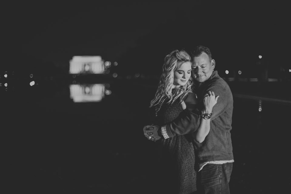 night portraits with the newly engaged couple and the lincoln monument